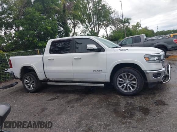 ✅ 2021 Ram 1500 Laramie • VIN: 1C6RREJT5MN628655 • Lot: 42734346. Listed on IAAI with 104,116 mi. Free auction sales archive from the USA and detailed vehicle history report at DreamBid. Image 13.