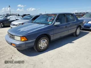 ✅ 1993 Dodge Spirit • VIN: 1B3XA46K0PF638477 • Lot: 75710534. Listed on Copart with 50,637 mi. Free auction sales archive from the USA and detailed vehicle history report at DreamBid. Image 1.