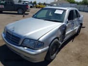 ✅ 1999 Mercedes-Benz C 230/260/280/320 • VIN: WDBHA29G2XA704389 • Lot: 42899909. Listed on IAAI with 225,873 mi. Free auction sales archive from the USA and detailed vehicle history report at DreamBid. Image 2.