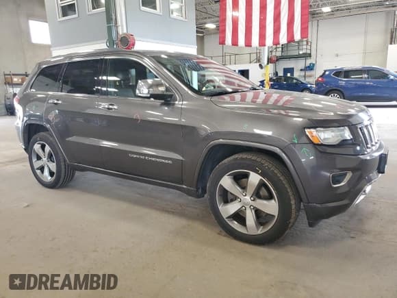 ✅ 2014 Jeep Grand Cherokee Overland • VIN: 1C4RJFCM8EC434713 • Lot: 68151405. Listed on Copart with 118,503 mi. Free auction sales archive from the USA and detailed vehicle history report at DreamBid. Image 4.