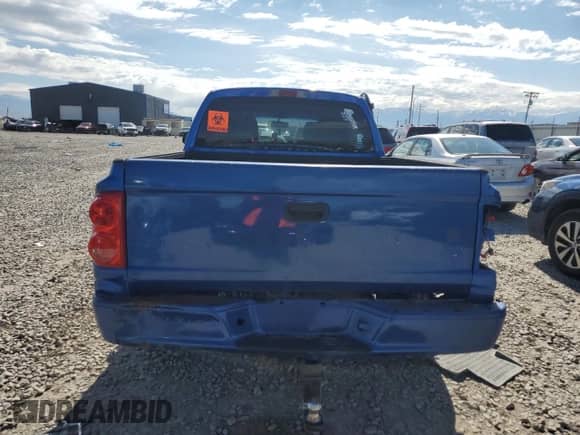 2007 Dodge Dakota SLT z VIN 1D7HW48N07S145519, wystawiony jako Copart lot #56992145 z przebiegiem Nie podano mil oraz Szkoda całkowita • Salvage title. Historia ofert i sprzedaży dostępna na DreamBid. Obrazek 6.