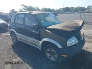✅ 1999 Suzuki Grand Vitara JLX • VIN: JS3TD62V2X4120349 • Lot: 42819058. Wystawiony na IAAI z przebiegiem 320 149 mil. Bezpłatny archiwum sprzedaży aukcyjnych z USA i szczegółowy raport historii pojazdu na DreamBid. Zdjęcie 1.