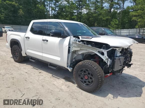 ✅ 2023 Toyota Tundra TRD Pro Hybrid • VIN: 5TFPC5DB8PX026040 • Lot: 63108315. Listed on Copart with 30,920 mi. Free auction sales archive from the USA and detailed vehicle history report at DreamBid. Image 4.