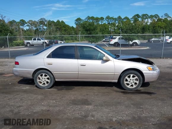 ✅ 1999 Toyota Camry LE • VIN: 4T1BF28K9XU076498 • Lot: 43160630. Listed on IAAI with 196,460 mi. Free auction sales archive from the USA and detailed vehicle history report at DreamBid. Image 13.