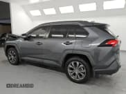 ✅ 2023 Toyota RAV4 Hybrid XLE Premium • VIN: JTMB6RFV9PD085163 • Лот: 84563665. Опубликован ранее на Copart с пробегом 115 711 миль. Бесплатный доступ к архиву аукционных продаж из США и подробный отчёт об истории автомобиля на DreamBid. Изображение 2.