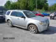 2010 Mercury Mariner with VIN 4M2CN9BG0AKJ21754, listed as a IAAI auction lot 42192286 with 196,749 mi miles and . Bid and sale history available at DreamBid. Image 1.