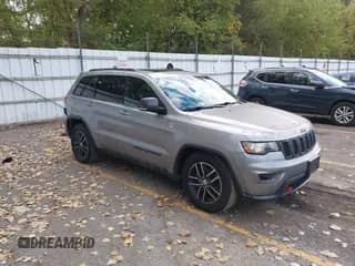 2017 Jeep Grand Cherokee Trailhawk with VIN 1C4RJFLG1HC733460, listed as a IAAI auction lot 43428007 with 149,029 mi miles and . Bid and sale history available at DreamBid. Image 1.
