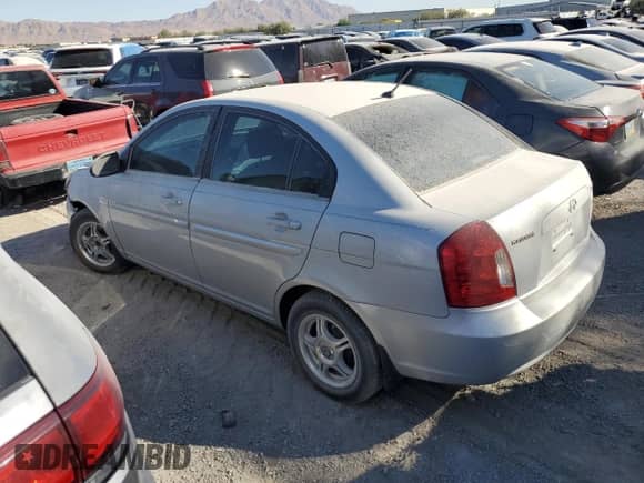 2007 Hyundai Accent GLS z VIN KMHCN46CX7U102105, wystawiony jako Copart lot #65793504 z przebiegiem 213 972 mil mil oraz Szkoda całkowita • Salvage title. Historia ofert i sprzedaży dostępna na DreamBid. Obrazek 2.