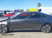 ✅ 2018 Honda Civic EX-T • VIN: JHMFC1F34JX008280 • Lot: 43809009. Listed on IAAI with 122,246 mi. Free auction sales archive from the USA and detailed vehicle history report at DreamBid. Image 14.