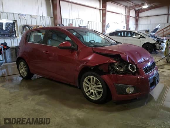 2013 Chevrolet Sonic LT с VIN 1G1JD6SH5D4130913, выставлен на аукционе Copart как лот 83786824 с пробегом 186 881 миль миль и Списание • Salvage title. История ставок и продаж доступна на DreamBid. Изображение 4.
