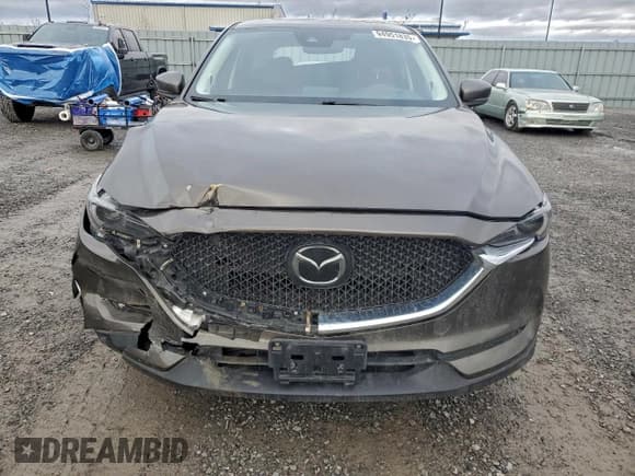 ✅ 2019 Mazda CX-5 Grand Touring • VIN: JM3KFBDMXK0630022 • Лот: 94951835. Опубликован ранее на Copart с пробегом 128 358 миль. Бесплатный доступ к архиву аукционных продаж из США и подробный отчёт об истории автомобиля на DreamBid. Изображение 5.
