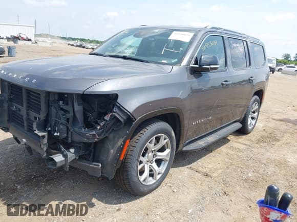 ✅ 2023 Jeep Wagoneer Series II Carbide • VIN: 1C4SJVBPXPS515874 • Lot: 42536034. Listed on IAAI with 56,284 mi. Free auction sales archive from the USA and detailed vehicle history report at DreamBid. Image 2.