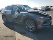 ✅ 2021 Mazda CX-5 Signature • VIN: JM3KFBEY1M0425242 • Lot: 91067215. Wystawiony na Copart z przebiegiem 77 579 mil. Bezpłatny archiwum sprzedaży aukcyjnych z USA i szczegółowy raport historii pojazdu na DreamBid. Zdjęcie 4.