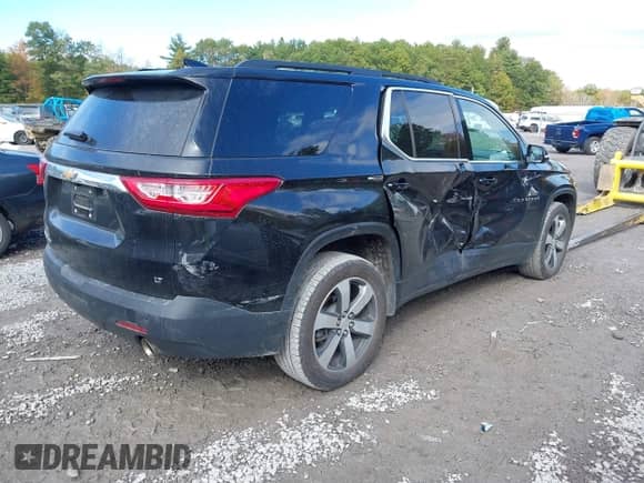 2020 Chevrolet Traverse LT z VIN 1GNEVHKW3LJ106407, wystawiony jako IAAI lot #43463464 z przebiegiem 103 973 mil mil oraz . Historia ofert i sprzedaży dostępna na DreamBid. Obrazek 4.