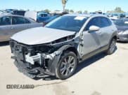 ✅ 2024 Mazda CX-30 S Preferred • VIN: 3MVDMBCM0RM718429 • Lot: 43461659. Listed on IAAI with 7,309 mi. Free auction sales archive from the USA and detailed vehicle history report at DreamBid. Image 2.