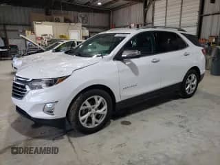2018 Chevrolet Equinox Premier с VIN 3GNAXPEU0JS609837, выставлен на аукционе Copart как лот 59108565 с пробегом 143 942 миль миль и Списание • Salvage title. История ставок и продаж доступна на DreamBid. Изображение 1.