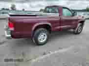 2000 Dodge Dakota Sport z VIN 1B7GG26N5YS650791, wystawiony jako Copart lot #63601765 z przebiegiem 80 841 mil mil oraz Szkoda całkowita • Salvage title. Historia ofert i sprzedaży dostępna na DreamBid. Obrazek 3.