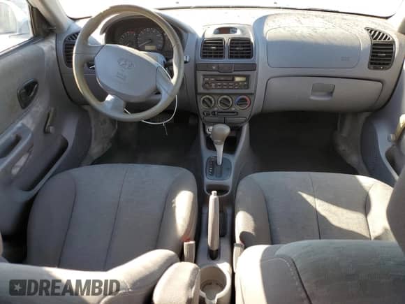 2004 Hyundai Accent GL z VIN KMHCG45C14U537604, wystawiony jako Copart lot #55402905 z przebiegiem 116 608 mil mil oraz Szkoda całkowita • Salvage title. Historia ofert i sprzedaży dostępna na DreamBid. Obrazek 8.