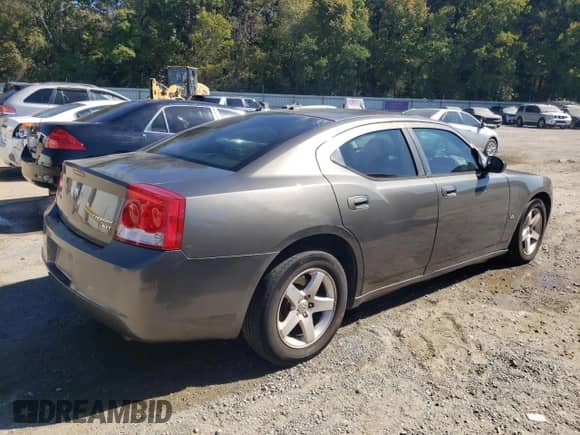 2009 Dodge Charger SXT с VIN 2B3KA33V09H566345, выставлен на аукционе Copart как лот 77218464 с пробегом 284 499 миль миль и Списание • Salvage title. История ставок и продаж доступна на DreamBid. Изображение 3.