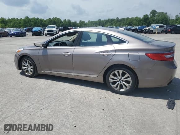 ✅ 2013 Hyundai Azera • VIN: KMHFG4JG4DA240690 • Лот: 57465565. Опубликован ранее на Copart с пробегом 164 757 миль. Бесплатный доступ к архиву аукционных продаж из США и подробный отчёт об истории автомобиля на DreamBid. Изображение 2.