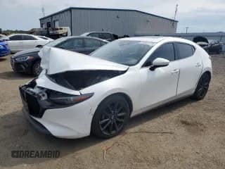 ✅ 2019 Mazda 3 Premium • VIN: JM1BPANM9K1144133 • Лот: 80567775. Опубликован ранее на Copart с пробегом 106 553 миль. Бесплатный доступ к архиву аукционных продаж из США и подробный отчёт об истории автомобиля на DreamBid. Изображение 1.