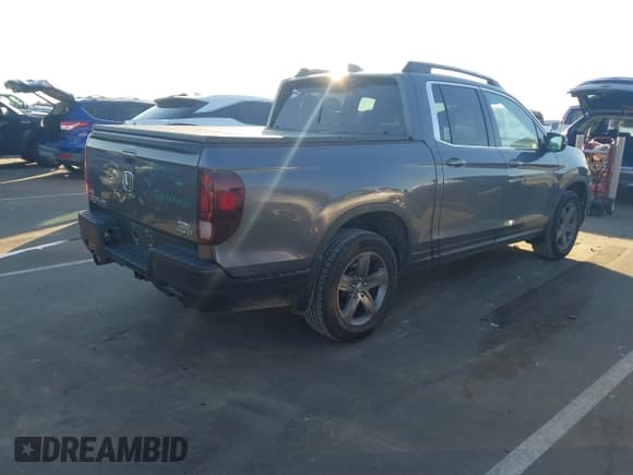 ✅ 2022 Honda Ridgeline RTL • VIN: 5FPYK3F52NB002849 • Lot: 43720277. Listed on IAAI with 71,325 mi. Free auction sales archive from the USA and detailed vehicle history report at DreamBid. Image 4.