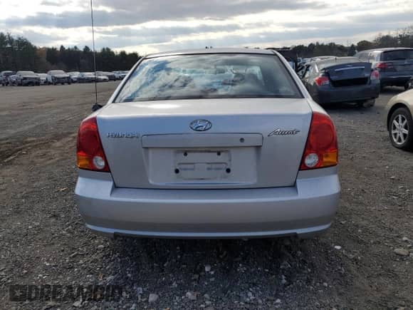 2005 Hyundai Accent GLS with VIN KMHCG45C05U618580, listed as a Copart auction lot 79239064 with 54,228 mi miles and Salvage title. Bid and sale history available at DreamBid. Image 6.