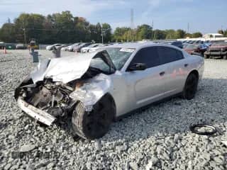 2014 Dodge Charger Police with VIN 2C3CDXAT7EH248174, listed as a Copart auction lot 81545715 with 162,845 mi miles and Salvage title. Bid and sale history available at DreamBid. Image 1.