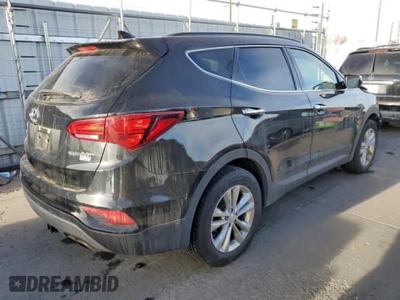 ✅ 2018 Hyundai Santa Fe 2.0T • VIN: 5NMZUDLA6JH106106 • Лот: 71894072. Опубликован ранее на Copart с пробегом 54 296 миль. Бесплатный доступ к архиву аукционных продаж из США и подробный отчёт об истории автомобиля на DreamBid. Изображение 3.