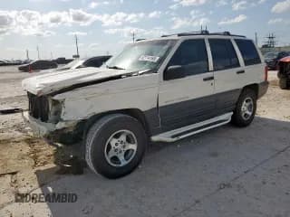 ✅ 1996 Jeep Grand Cherokee Laredo • VIN: 1J4FX58S6TC194152 • Lot: 62114165. Wystawiony na Copart z przebiegiem 50 956 mil. Bezpłatny archiwum sprzedaży aukcyjnych z USA i szczegółowy raport historii pojazdu na DreamBid. Zdjęcie 1.
