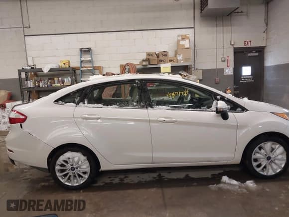 ✅ 2017 Ford Fiesta Titanium • VIN: 3FADP4CJ2HM123869 • Lot: 41571724. Wystawiony na IAAI z przebiegiem 103 452 mil. Bezpłatny archiwum sprzedaży aukcyjnych z USA i szczegółowy raport historii pojazdu na DreamBid. Zdjęcie 14.