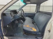 ✅ 1989 Nissan Hardbody • VIN: 1N6ND11S6KC399804 • Lot: 84070345. Wystawiony na Copart z przebiegiem 241 780 mil. Bezpłatny archiwum sprzedaży aukcyjnych z USA i szczegółowy raport historii pojazdu na DreamBid. Zdjęcie 7.