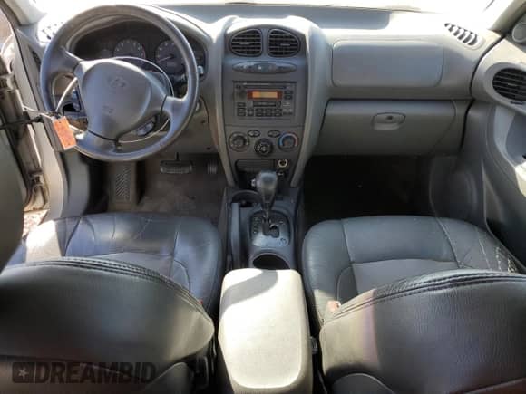 2002 Hyundai Santa Fe GLS z VIN KM8SC13D42U228062, wystawiony jako Copart lot #88159455 z przebiegiem 133 554 mil mil oraz Szkoda całkowita • Salvage title. Historia ofert i sprzedaży dostępna na DreamBid. Obrazek 8.