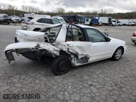 ✅ 2000 Mazda Protege DX • VIN: JM1BJ2223Y0295154 • Lot: 79511954. Wystawiony na Copart z przebiegiem 116 781 mil. Bezpłatny archiwum sprzedaży aukcyjnych z USA i szczegółowy raport historii pojazdu na DreamBid. Zdjęcie 3.