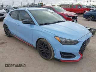2020 Hyundai Veloster z VIN KMHT36AH6LU004705, wystawiony jako IAAI lot #42014151 z przebiegiem 155 813 mil mil oraz . Historia ofert i sprzedaży dostępna na DreamBid. Obrazek 1.
