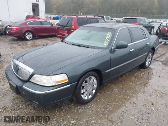 ✅ 2003 Lincoln Town Car Cartier • VIN: 1LNHM83W73Y651035 • Lot: 43579973. Listed on IAAI with 244,866 mi. Free auction sales archive from the USA and detailed vehicle history report at DreamBid. Image 2.