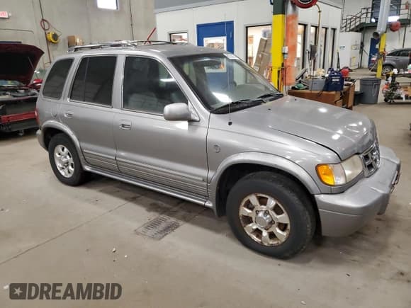 ✅ 2001 Kia Sportage • VIN: KNDJA723615043568 • Lot: 83738434. Listed on Copart with 113,739 mi. Free auction sales archive from the USA and detailed vehicle history report at DreamBid. Image 4.