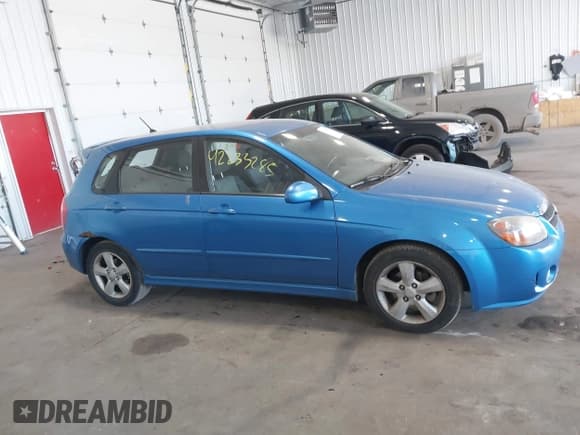 ✅ 2008 Kia Spectra • VIN: KNAFE162485017759 • Lot: 42233285. Listed on IAAI with 165,412 mi. Free auction sales archive from the USA and detailed vehicle history report at DreamBid. Image 13.