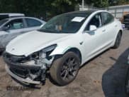 ✅ 2019 Tesla Model 3 Mid Range • VIN: 5YJ3E1EA8KF482825 • Lot: 43222903. Listed on IAAI with 65,737 mi. Free auction sales archive from the USA and detailed vehicle history report at DreamBid. Image 2.