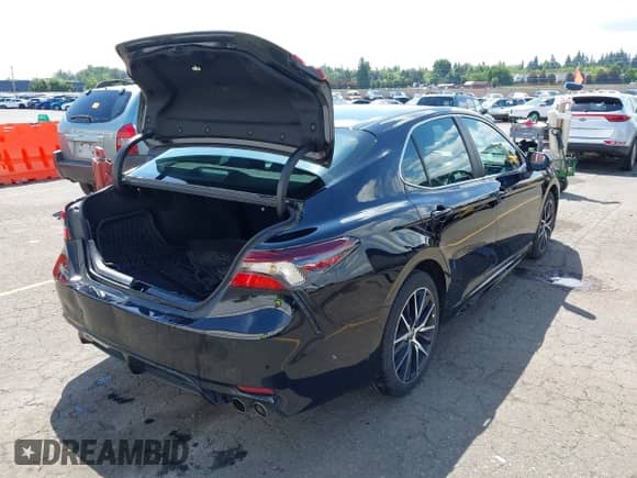 2022 Toyota Camry SE with VIN 4T1G11BK1NU050000, listed as a IAAI auction lot 42348766 with 57,429 mi miles and . Bid and sale history available at DreamBid. Image 4.