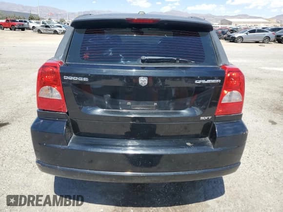 ✅ 2009 Dodge Caliber SXT • VIN: 1B3HB48A29D103266 • Лот: 68567414. Опубликован ранее на Copart с пробегом 98 633 миль. Бесплатный доступ к архиву аукционных продаж из США и подробный отчёт об истории автомобиля на DreamBid. Изображение 6.