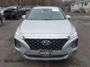 ✅ 2019 Hyundai Santa Fe SE • VIN: 5NMS2CAD7KH054274 • Lot: 43694931. Listed on IAAI with 96,329 mi. Free auction sales archive from the USA and detailed vehicle history report at DreamBid. Image 12.