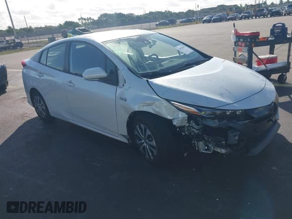 ✅ 2021 Toyota Prius XLE • VIN: JTDKAMFP2M3181138 • Lot: 43818185. Listed on IAAI with 103,925 mi. Free auction sales archive from the USA and detailed vehicle history report at DreamBid. Image 1.