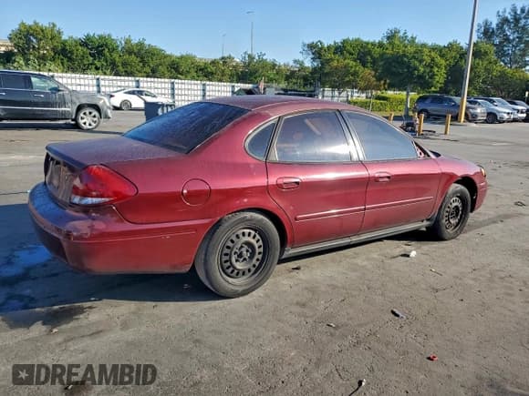 ✅ 2005 Ford Taurus SE • VIN: 1FAFP53UX5A252153 • Lot: 94035295. Listed on Copart with 83,532 mi. Free auction sales archive from the USA and detailed vehicle history report at DreamBid. Image 3.