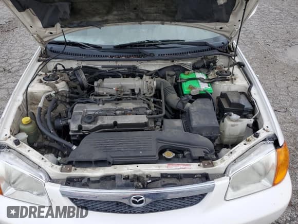 ✅ 2000 Mazda Protege DX • VIN: JM1BJ2223Y0295154 • Lot: 79511954. Wystawiony na Copart z przebiegiem 116 781 mil. Bezpłatny archiwum sprzedaży aukcyjnych z USA i szczegółowy raport historii pojazdu na DreamBid. Zdjęcie 11.