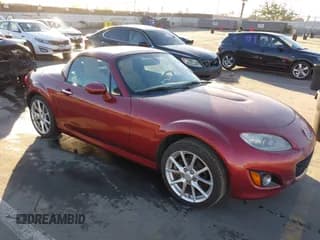 ✅ 2012 Mazda MX-5 Miata Grand Touring • VIN: JM1NC2PF0C0220326 • Lot: 41264059. Listed on IAAI with 100,192 mi. Free auction sales archive from the USA and detailed vehicle history report at DreamBid. Image 1.