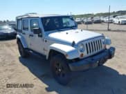 ✅ 2007 Jeep Wrangler Unlimited Sahara • VIN: 1J4GA591X7L101991 • Lot: 43233527. Listed on IAAI with 156,024 mi. Free auction sales archive from the USA and detailed vehicle history report at DreamBid. Image 1.