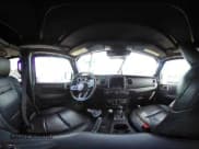 ✅ 2023 Jeep Wrangler Sahara • VIN: 1C4JJXP64PW568165 • Lot: 42740617. Listed on IAAI with 86,559 mi. Free auction sales archive from the USA and detailed vehicle history report at DreamBid. Image 24.