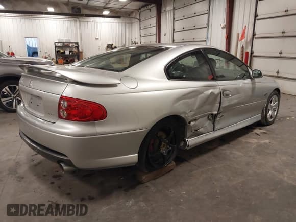 ✅ 2005 Pontiac GTO • VIN: 6G2VX12U55L367948 • Lot: 43061820. Listed on IAAI with 59,308 mi. Free auction sales archive from the USA and detailed vehicle history report at DreamBid. Image 4.
