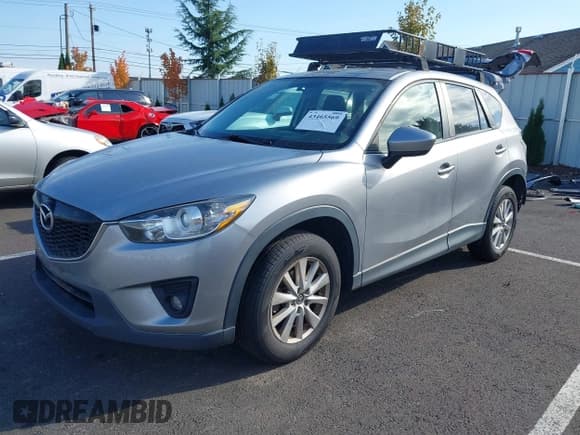 ✅ 2015 Mazda CX-5 Touring • VIN: JM3KE4CY6F0430800 • Lot: 43465569. Listed on IAAI with 163,870 mi. Free auction sales archive from the USA and detailed vehicle history report at DreamBid. Image 2.